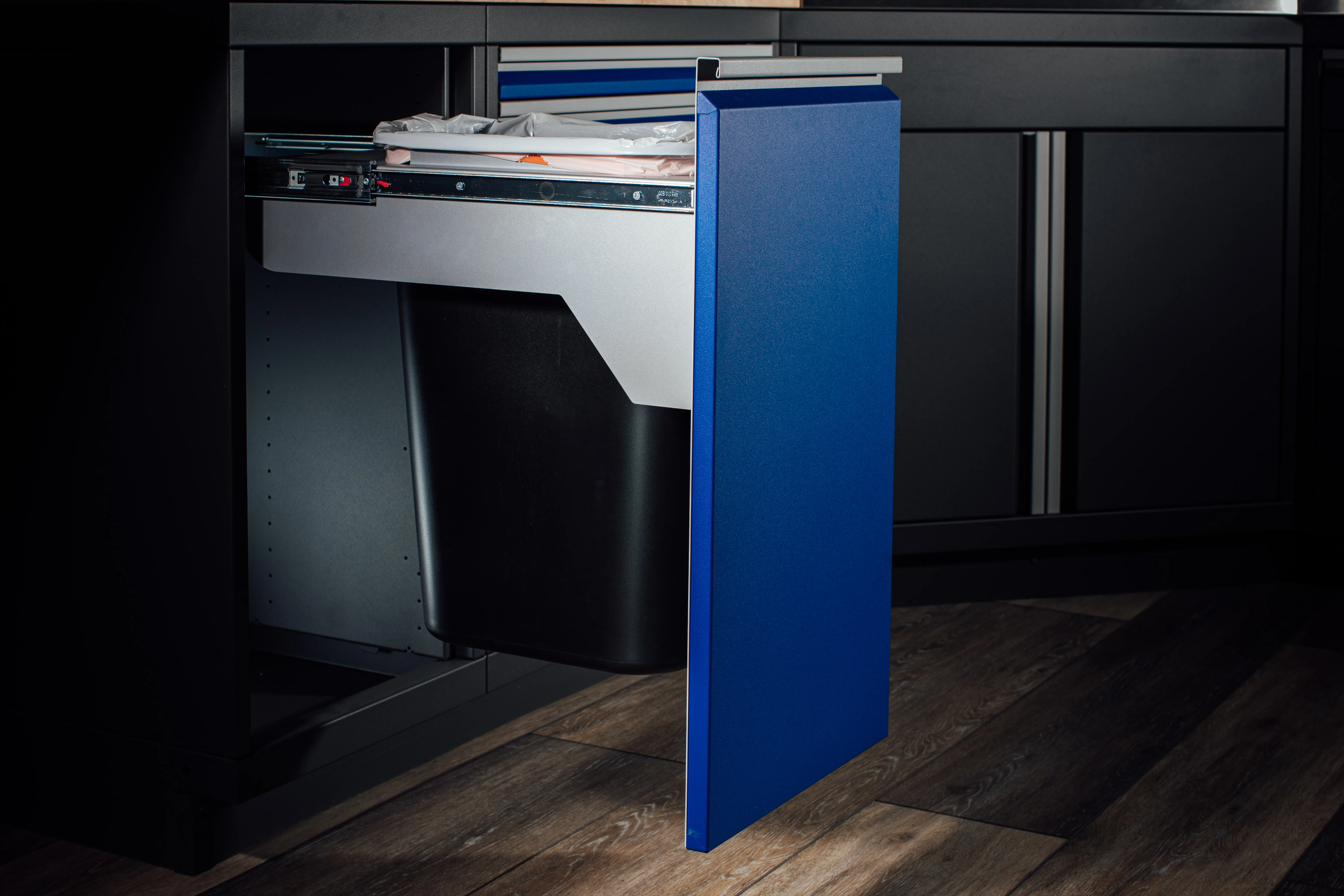 Trash Bin Cabinet Image, showcasing a trash bin cabinet with a sleek, modern design, featuring a combination of drawers and cabinets for efficient storage and organization.